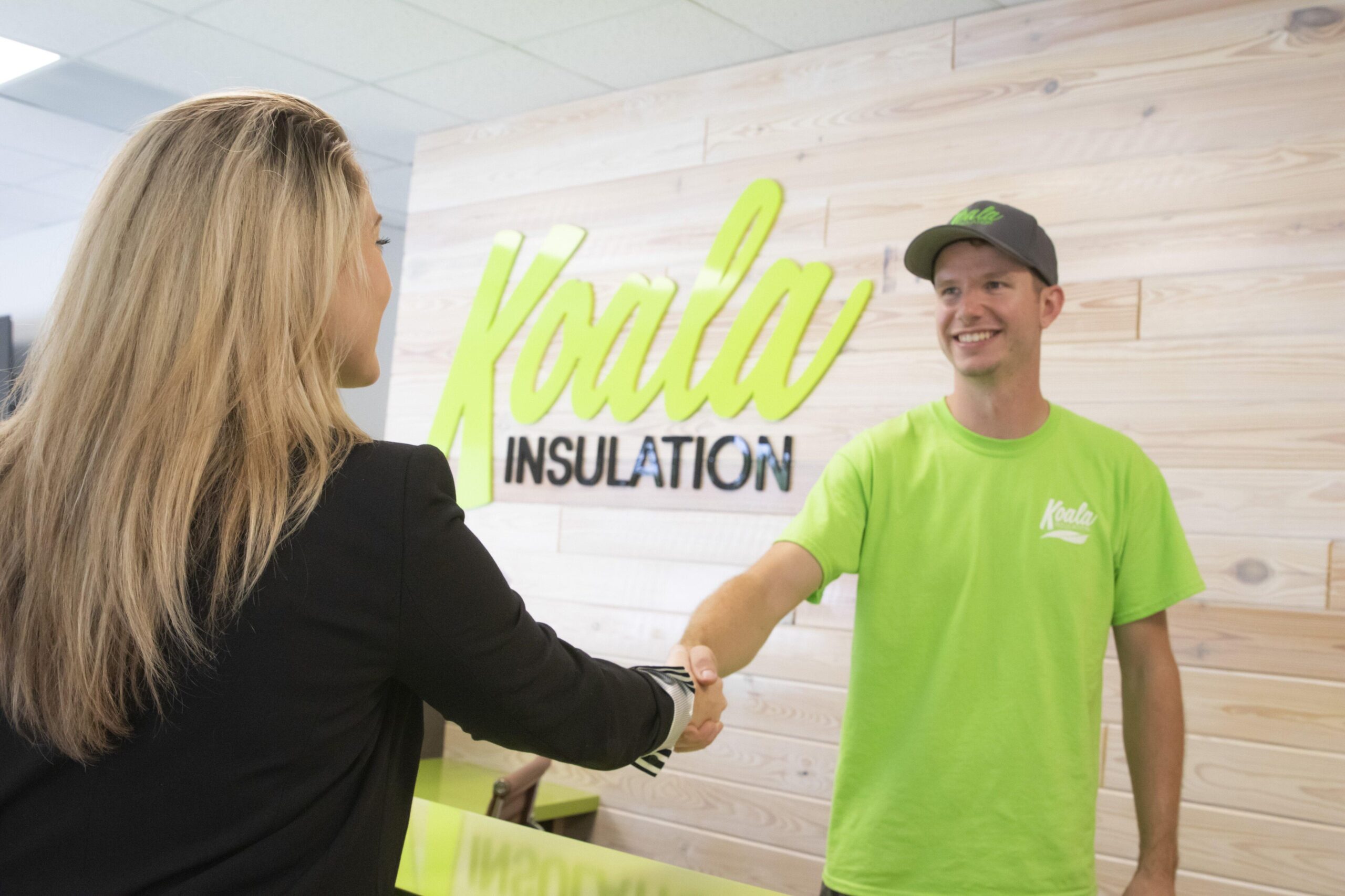Customer shaking hands with Koala Insulation Canada employee